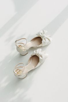 Bridal shoes 'Jemila' are handcrafted from soft Italian satin and have a 5.5 cm / 2.2 inches pointy heel.  Elegant yet minimalist style wedding sandals will perfectly complement your wedding gown.  Sandals decorated with a fabulous satin bow. Inside there is a soft Memory foam insole, which gives a feeling of additional comfort when walking. Tunit outsole is made of a mixture of leather chips and rubber, it's more wear-resistant than leather and more durable. Also, we use soft natural upper materials that wear well and take the shape of the foot. You can customize shoes' embroidery, heel, color etc. - we offer a lot of options.  OUR SHOES ARE MADE-TO-MEASURE ONLY. We start to craft the shoes only after you place the order. Please add to the cart the size you usually wear and I'll contact y White Kitten Heels With Ankle And Heel Straps, Cream Closed Toe Sandals For Wedding, White Closed Toe Sandals With Bow, Closed Toe Wedding Shoes With Bow, Cream Ankle Strap Wedding Shoes For Ceremony, White Closed Toe Kitten Heels With Heel Strap, White Kitten Heels With Ankle Strap, Spring Ceremony Ankle Strap Heels, Wedding Open Toe Kitten Heels With Wrapped Heel