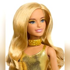 a barbie doll with blonde hair wearing a gold dress and choker on her neck