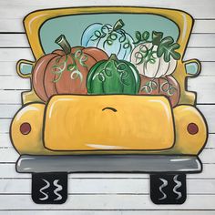 a painting of pumpkins and squash in a yellow car on a white wooden background