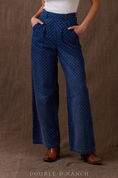 DENIM’S NEVER BEEN SO DARLING.Inspired by 19th Century Stifel-style printing, the Circle Dot Vest is an indigo-dyed denim in a polka dot pattern embellished with ornately embroidered florals. This ultra-chic pant is a modern wide-leg silhouette with flattering front pleats and sleek side-button waistband. color: denim content: 100% cotton embellishments: custom print size: 2-18 fit: relaxed style number: P602 collection: Chisholm Trail Chisholm Trail, Dyed Denim, Chic Pants, Cashmere Accessories, Stocking Gifts, The Circle, Silver Accessories, Polka Dot Pattern, Vest Top