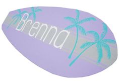 a purple surfboard with palm trees on the bottom and white lettering that says bema