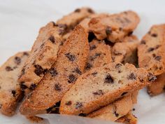 chocolate chip cookies are piled on top of each other