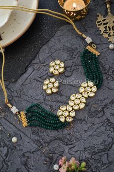 The green Kundan choker necklace set is inspired by the rich Indian jewelry-making techniques handcrafted by the artisans to celebrate the amalgamation of craftsmanship and modern design. The Indian Kundan choker is a most elegant and perfectly crafted choker to bejewel your neckline with shimmering Kundan that will create a style statement wherever you go. Pair this gorgeous replica of Bollywood jewelry with your ethnic or contemporary ensembles and create a look to remember.  An ode to the bea Green Meenakari Choker For Festivals, Festive Green Meenakari Choker, Festive Green Handmade Choker, Green Kundan Choker Necklace For Diwali, Traditional Green Kundan Necklace For Party, Handmade Green Choker For Celebration, Green Kundan Choker Necklace For Gifting, Green Kundan Necklace With Round Beads For Party, Green Beaded Kundan Necklace For Party