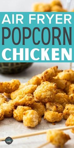 fried air fryer popcorn chicken on a sheet of parchment paper with toothpicks