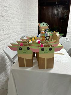 some paper bags that are shaped like yoda from the child's movie star wars