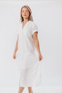 This midi dress just feels summer-ready. The Paris Shirt Dress features a classic collared neckline, with easy short sleeves and a flowy fit that will be an instant favorite. Add a belt and mules and you've aced everyday glamour. FIT: Runs true to size - relaxed fit. MATERIAL: 55% Linen, 45% Viscose. Machine wash cold. GARMENT DETAILS: Linen-blend shirt dress with collared V-neckline, button front placket, and chest pockets. Features cuffed short sleeves and in-seam side pockets. SIZE GUIDE: XS Spring Button-up Midi Dress For Daywear, Spring Button-up Relaxed Fit Midi Dress, Summer Short Sleeve Shirt Dress For Spring, Spring Mid-length Shirt Dress For Day Out, Summer Casual Collared Midi Dress, Short Sleeve Shirt Dress For Spring And Summer, Short Sleeve Shirt Dress For Spring, Casual Collared Midi Dress For Summer, Relaxed Fit Button-up Midi Dress For Spring