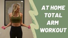 a woman standing in front of a wall with her arms spread out and the words at home total arm workout