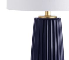 a blue table lamp with a white shade