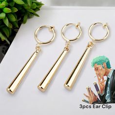 🗡️ Roronoa Zoro Earrings Set 🗡️ 🌟 Unisex Design: Perfect for both men and women who love the world of anime. -Cosplay Ready: Channel your inner swordsman with these Zoro-inspired earrings. -Long Column Pendant: Elegant and eye-catching, these earrings dangle gracefully. 👂 Ear Clip and Ear Stud: Versatile options for different styles and comfort. -High-Quality Material: Crafted with care to withstand your adventures. ⚔️ Honor Zoro's Spirit: Wear these earrings and embrace the spirit of the Wo Zoro Earrings, Zoro Cosplay, Anime Earrings, Anime Jewelry, Unusual Jewelry, Spirit Wear, Ear Stud, Men Earrings, Roronoa Zoro