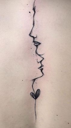 the back of a woman's neck with a line drawing of two faces on it