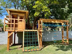 an outdoor play area with swings and climbing bars