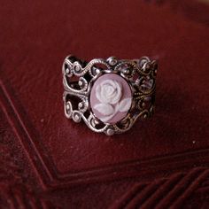 Victorian style antiqued adjustable filigree ring.At its center is a 10x8mm black and white rose cameo.This ring is adjustable to most sizes. Available in antiqued silver or bronze as well as other cameo colors. Each ring comes in a gift box. Top Engagement Rings, Victorian Cameo, Stamped Rings, Personal Image, Image Ideas, Cameo Ring, Jewelry Lookbook, Filigree Ring, Pink Ring