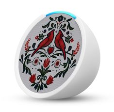 a white speaker with two red birds on it