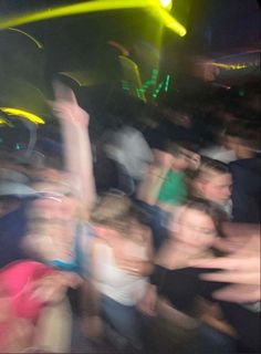 a blurry photo of people at a concert