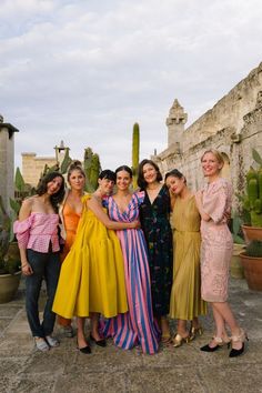 a group of women standing next to each other