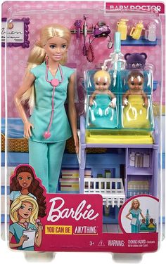 the barbie doll is standing in front of her baby care station with accessories on display