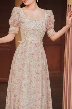 Square neck midi dress with short puff sleeves, lace trims and a lace up corset waist on a floral print and embroidered fabric. Concealed back zipper. S: 33" chest, 26.5" waist, 42.5" lengthM: 34.5" chest, 28" waist, 42.5" lengthL: 36" chest, 29.5" waist, 42.5" lengthXL: 37.5" chest, 31" waist, 42.5" length Vintage Corset Dress, Square Neck Puff Sleeve Dress, Flower Printed Dress, Square Neck Midi Dress, Floral Dress Outfits, Lace Neck, Frock For Women, Lace Up Corset, Corset Waist