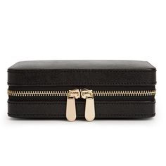 The perfect way to travel with your jewelry. This chic travel jewelry case made by Wolf is the perfect way to safely store your jewelry. This high quality case Includes anti-tarnish lining and gold finish. The dimensions of this case are 6.75" L X 4.5" W X 2.5" H. There are several sections in the case including four ring rolls, three storage compartments, a mirror and a spot for your earrings and necklaces. This style is available in black or rose gold and is perfect for keeping all of your jew Elegant Black Travel Cases, Elegant Portable Cases For Business, Elegant Compact Case With Included Case, Elegant Compact Case, Classic Rectangular Case, Elegant Round Business Case, Luxury Rectangular Jewelry Storage Case For Travel, Luxury Rectangular Travel Jewelry Storage Case, Gold Rectangular Jewelry Storage Case For Gift