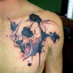 a man with a bear tattoo on his chest