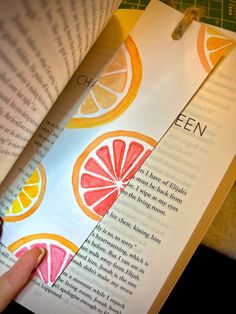 an open book with orange slices on it