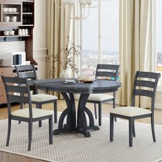 a dinning room table with four chairs around it