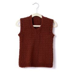 a brown sweater vest hanging on a white hanger