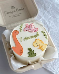 a decorated cake in a box on a table