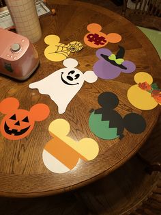 mickey mouse cutouts on a wooden table