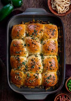 a casserole dish filled with bread and vegetables