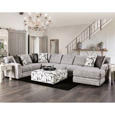 a living room filled with furniture and a chandelier