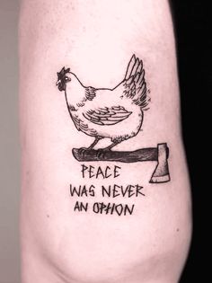 a tattoo with a chicken on it that says peace was never an option