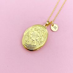 This is gold tone locket charm with hand stamped initial charm on brass or stainless-steel chain.  I do not put the photo to the locket ♥ You will receive ONE necklace. HOW TO ORDER 1) Choose the quantity. 2) Choose the initial in the option or add a note to seller at checkout. 3) Add to the cart. DESCRIPTION ♥ Necklace, Stainless Steel Chain with Lobster Claw Clasp, Size: about 17.7 inches (45cm) long, 1-2mm wide, Nickel Safe, *stainless steel is durable, highly resistant to rust and corrosion. Gold Charm Necklaces With Birth Flower For Keepsake, Gold Engraved Initial Pendant Locket Necklace, Personalized Pendant Locket Necklace For Mom, Gold Charm Necklace With Birth Flower For Keepsake, Engraved Initial Pendant Locket Necklace For Keepsake, Personalized Pendant Locket Necklace Gift For Mom, Gold Oval Pendant Charm Necklace Engraved, Round Locket Necklace For Mom, Gold Oval Pendant Locket Necklace For Personalized Gift