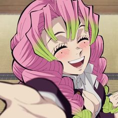 an anime character with pink hair and green eyes smiles at the camera while holding her hand out