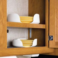 a cabinet with plates and bowls in it