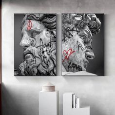 two black and white paintings with graffiti on them