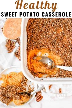 a casserole dish filled with sweet potato casserole and topped with pecans