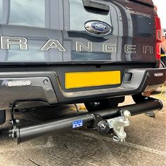 the rear end of a black ford ranger