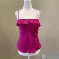 Beautiful Pink Silk Top With Camisole Straps. Ruffle Detailing Around The Chest Line And Back. Ruffle Down The Side. Pullover Styling. Lined. Length Is 23”. Never Been Worn. Original Tags. In Great Condition. Pink Ruffled Camisole Top, Fitted Ruffle Camisole Top, Pink Fitted Sleeveless Camisole, Pink Fitted Camisole, Ruffled Spaghetti Strap Top For Night Out, Chic Pink Ruffled Camisole, Chic Fitted Spaghetti Strap Blouse, Chic Fitted Blouse With Spaghetti Straps, Chic Pink Camisole With Ruffles