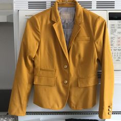 Brand New Condition. Yellow Blazer With Gold Buttons. Striped Interior Lining. Yellow Fitted Blazer For Work, Yellow Long Sleeve Outerwear For Office, Casual Yellow Blazer For Work, Fitted Yellow Outerwear For Office, Casual Yellow Outerwear For Office, Fitted Yellow Winter Blazer, Classic Single-breasted Yellow Blazer, Fitted Mustard Outerwear For Work, Fitted Yellow Blazer For Winter