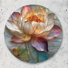 a white and pink flower is on a circular glass plate with water lilies in it