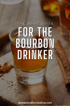 the best gifts for the bourbon drinker are on this wooden cutting board with cinnamon sticks and