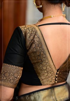 Step into any gathering with style! The timeless combination of bold black and luxurious gold is beautifully tailored to create a bold and beautiful silhouette. The wide zari borders add statement to the neckline in the front and back and being black, it can be effortlessly paired with many sarees! Need minor customizations? Ask us and we will try our best to make it happen! SIZE GUIDE : To determine your blouse size, please measure around the fullest part of your bust line using a measuring tape. Your bust measurement will correspond to the size you need to order. For example, if you measure 36 inches, please order size 36. If your measurement falls between sizes, you may order the next size up (for example, if you measure 39 inches, please order size 40) or consult with us for tailored o Deep V Neck Blouse, Fashionable Saree, Lace Blouse Design, Latest Blouse Designs Pattern, Traditional Blouse Designs