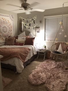 a bedroom with a hammock hanging from the ceiling and lights on the wall