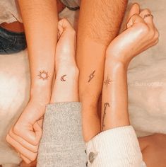 two people with matching tattoos on their arms