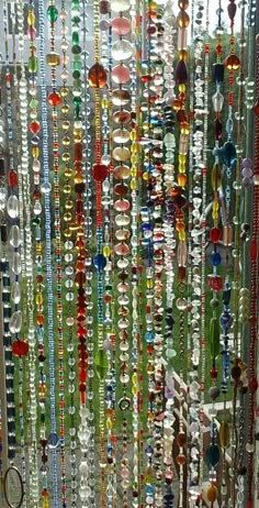 many different colored beads hanging from the ceiling