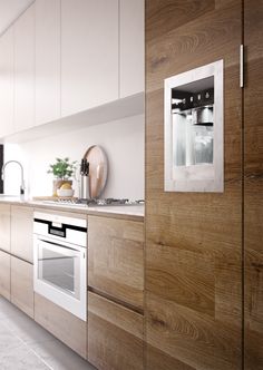 a kitchen with wooden cabinets and white appliances