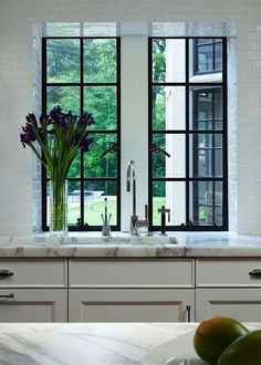 the kitchen counter is clean and ready to be used as a breakfast nook with fruit on it