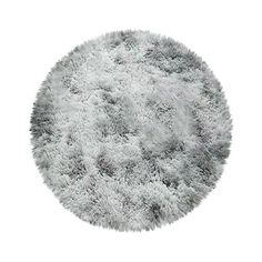 a round rug with white fur on it