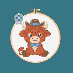 a cross stitch pattern with a cow wearing a cowboy hat and bow tie, sitting in front of a blue background