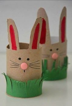 two paper cups that have rabbits in them